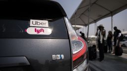 The Uber and Lyft stickers are displayed on a car at LAX Rideshare Lot 1 as Mobile Workers Alliance organizes a rally close by as part of a statewide day of action to demand that both ride-hailing companies follow California law and grant drivers basic employee rights and to denounce the corporations efforts to avoid their responsibilities to workers, in Los Angeles, California, USA, 20 August 2020. Lyft and Uber threatened this morning to shut down their operation in California tonight at 11.59pm, but an emergency stay granted by a state appeal court allowed Uber and Lyft to continue operating without reclassifying their drivers.