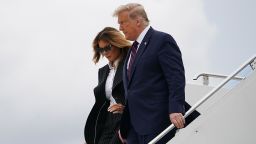 US President Donald Trump and First Lady Melania Trump step off Air Force One upon arrival at Cleveland Hopkins International Airport in Cleveland, Ohio on September 29, 2020. - President Trump is in Cleveland, Ohio for the first of three presidential debates. 
