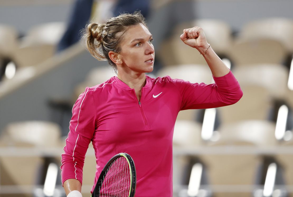 Halep celebrates after winning a point against Anisimova.