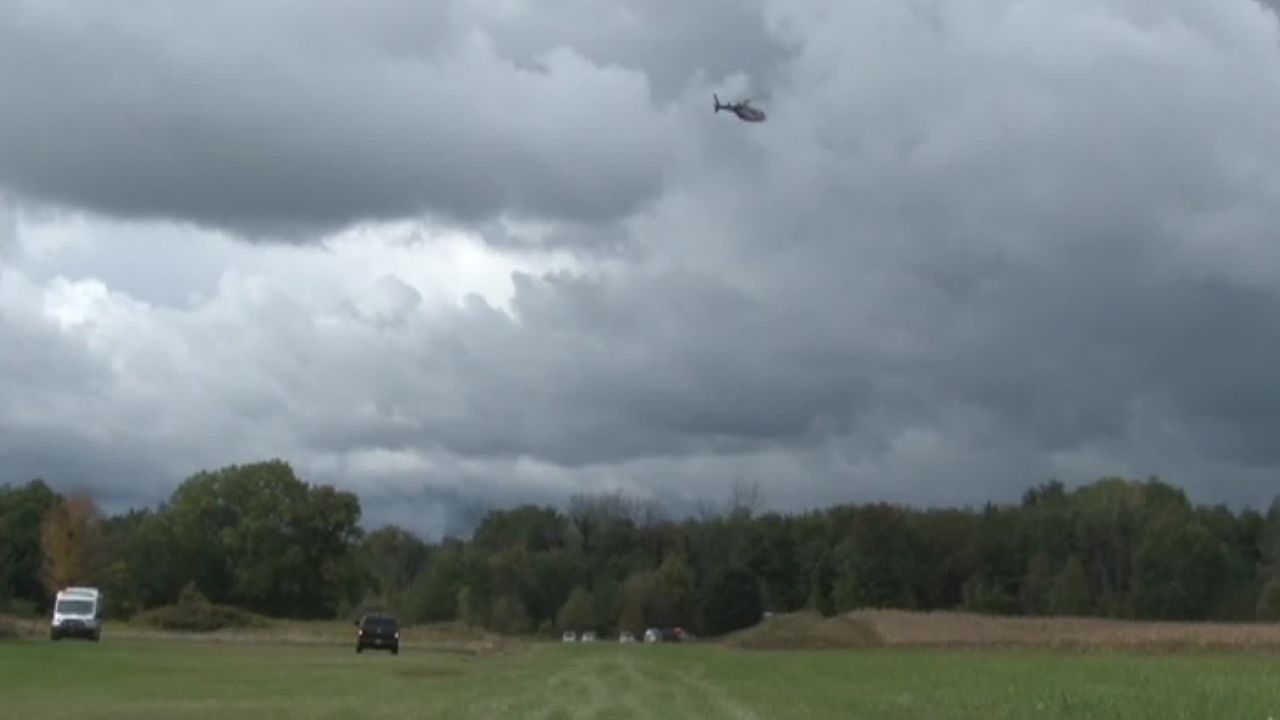 Helicopter hovers over the scene of a deadly small plane crash near Pembroke, New York.
