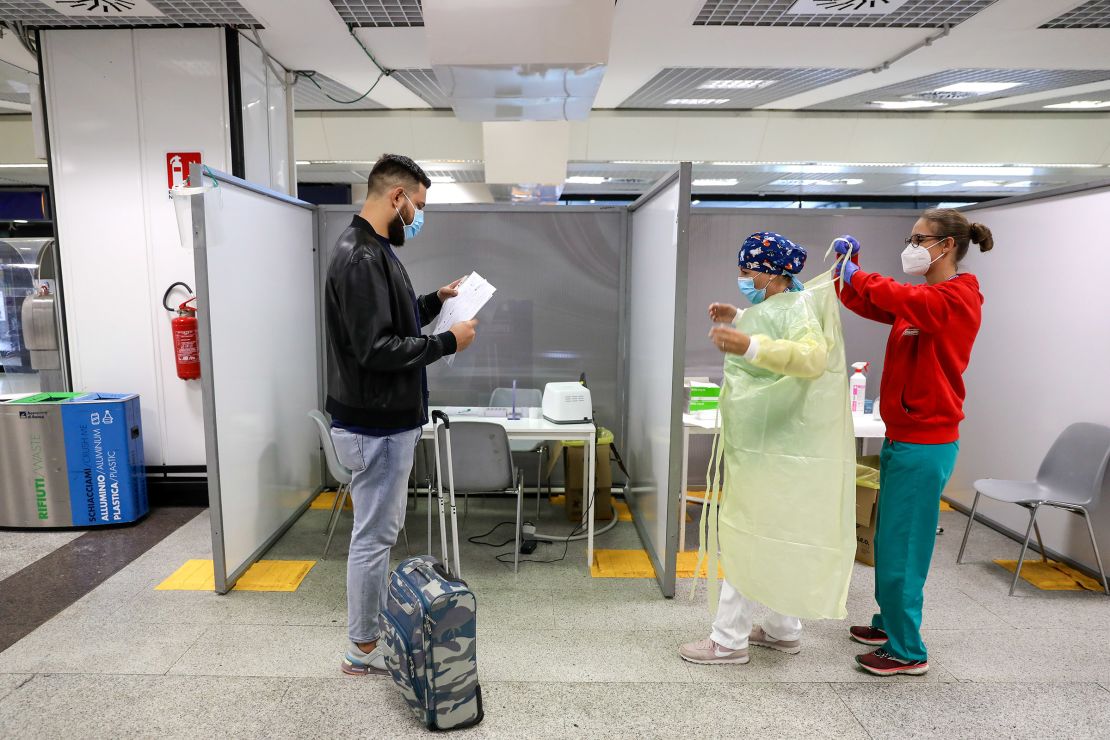 A passenger waits to undergo a swab test at a Covid-19 rapid test facility at Fiumicino Airport in Rome, September 25.