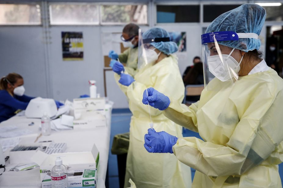 Medical staff hold swabs for rapid Covid-19 tests at a high school in Rome on September 28. 