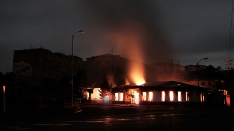 In this image, distributed by the Armenian government, a building burns after recent shelling during the ongoing fighting between Armenia and Azerbaijan over the breakaway Nagorno-Karabakh region, in the city of Stepanakert early on October 4.