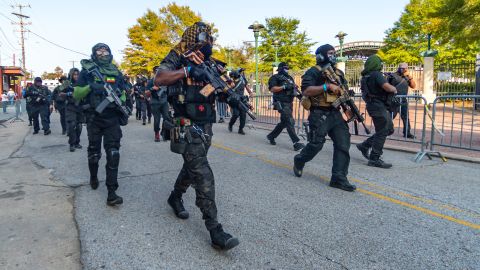 Members of the NFAC paramilitary group hold a demonstration in Parc San Souci in downtown Lafayette, Louisiana, on Saturday.