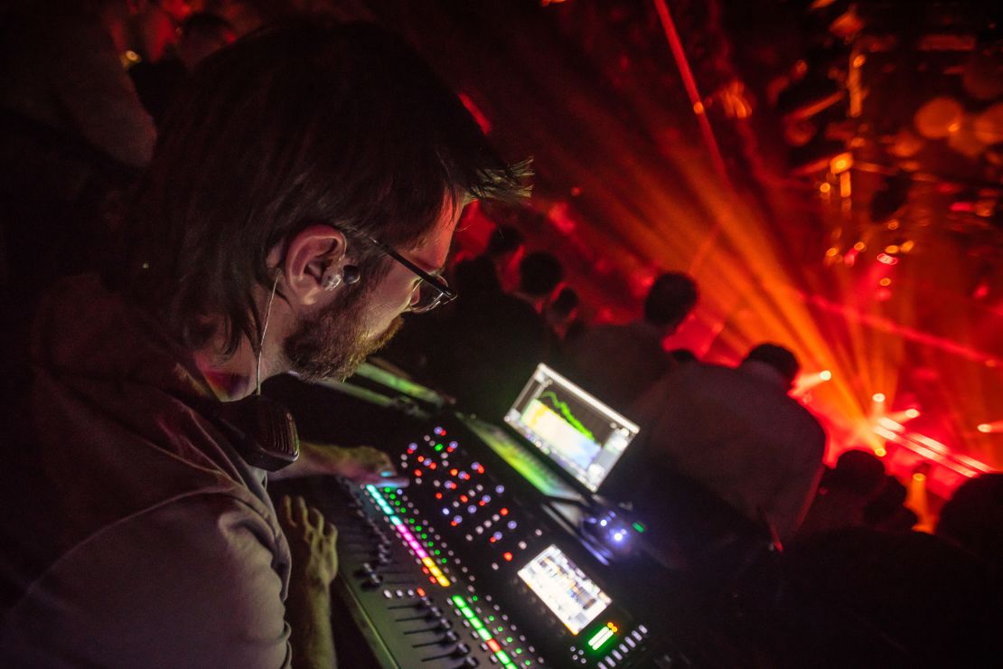 Justin Doan works the sound board at a concert in Boston in February, shortly before he lost his job with the shutdown of live music events due to the pandemic.