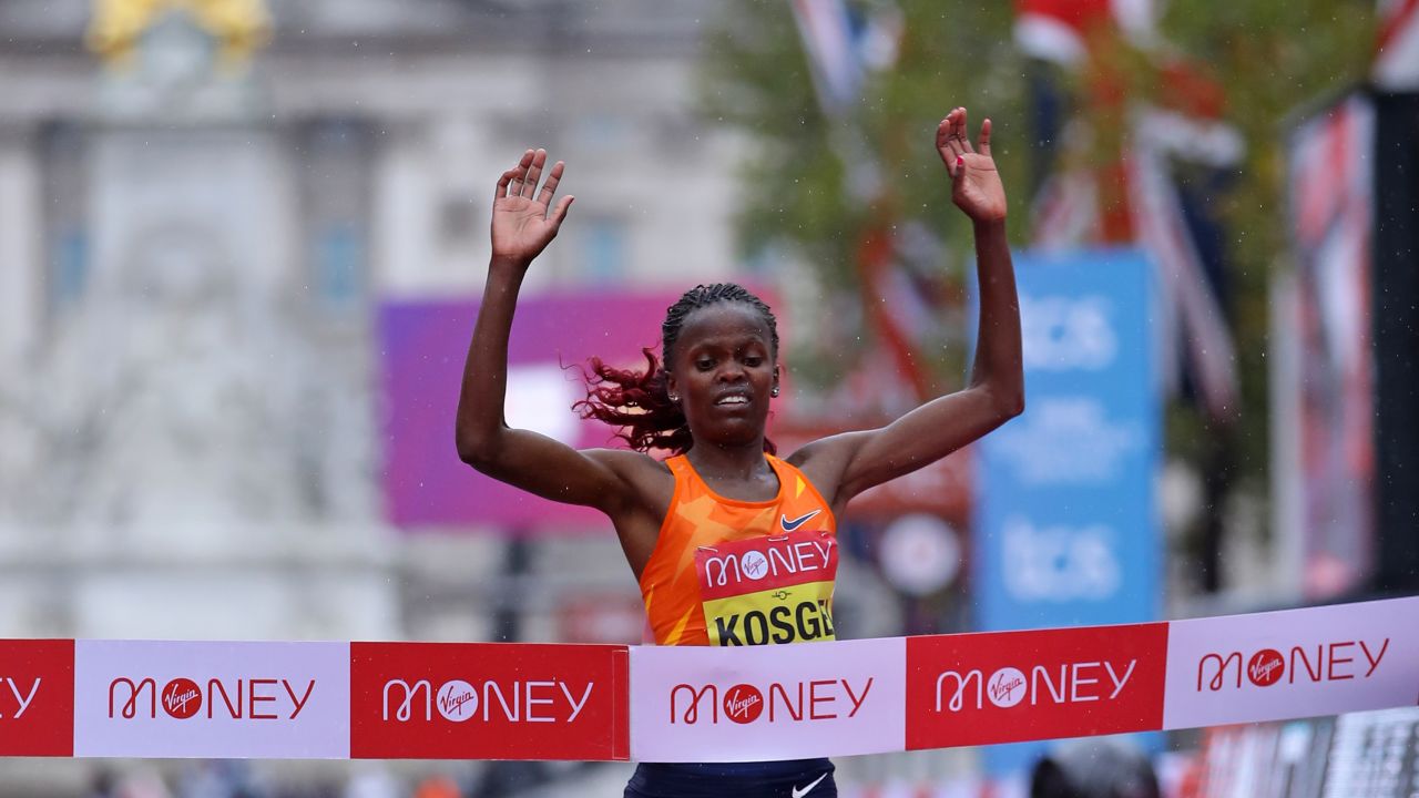 Kosgei crosses the finish line to defend her title in London. 