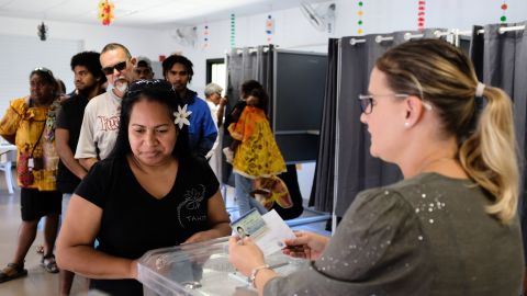 A woman casts her vote at a polling station in Nouméa, the capital of New Caledonia, on Sunday. 