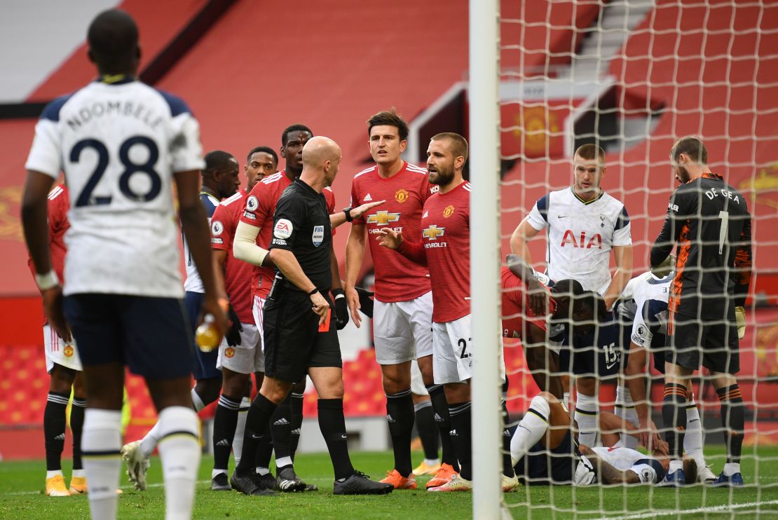 Anthony Taylor shows Manchester United's Anthony Martial a red card.