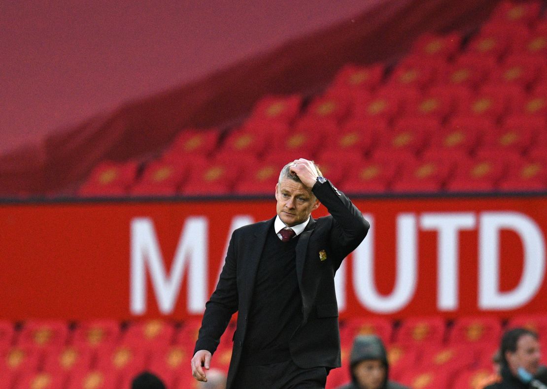 Solskjaer walks off the pitch following his side's defeat. 