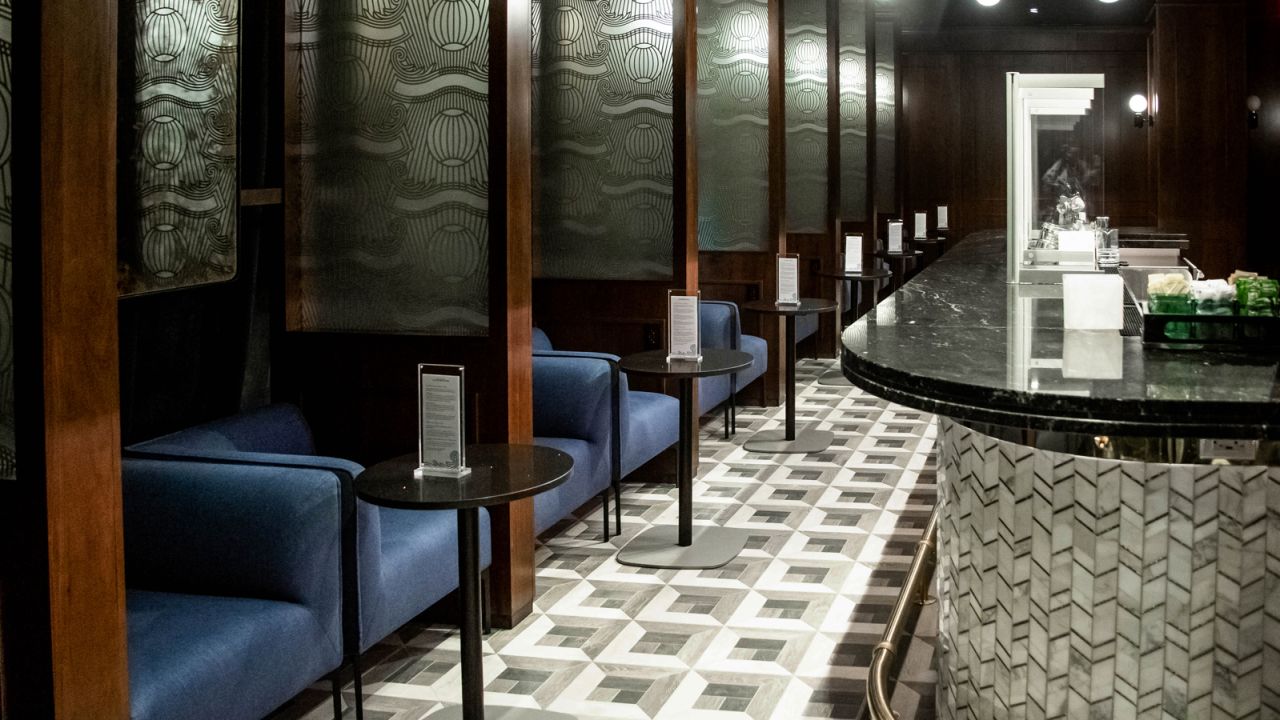 The JFK lounge has its own Prohibition-era inspired speakeasy hidden behind a wall.
