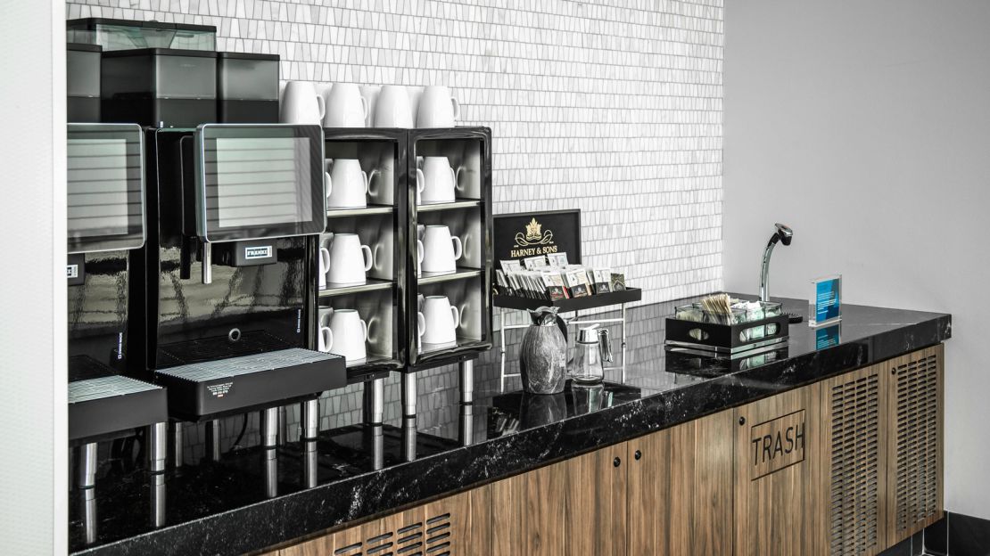 A self-service coffee area on the upper floor will be open when the lounge opens.