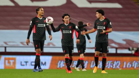 Liverpool players react after Aston Villa's sixth goal.