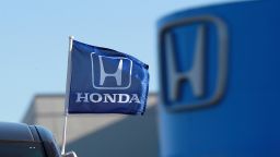 A flag with the Honda logo is displayed on brand new Honda car at Marin Honda on December 2, 2011 in San Rafael, California.  Honda Motor Co. announced today that they are recalling 304,000 vehicles around the globe for a possible airbag malfunction in Accord, Civic, Odyssey, Pilot, CR-V and other models that were manufactured between 2001 and 2002.  (Photo by Justin Sullivan/Getty Images)