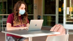 Students are allowed to participate in in-person classes as long as they wear a mask and socially distance from one another. 