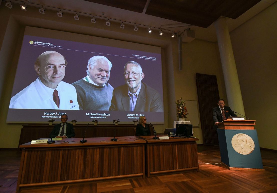 Thomas Perlmann (right), the Secretary of the Nobel Committee, announces the winners.