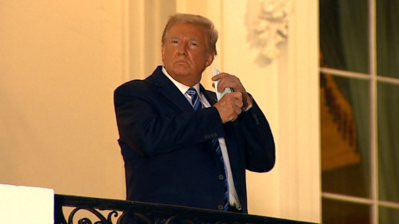 The President removed his mask before entering the White House.