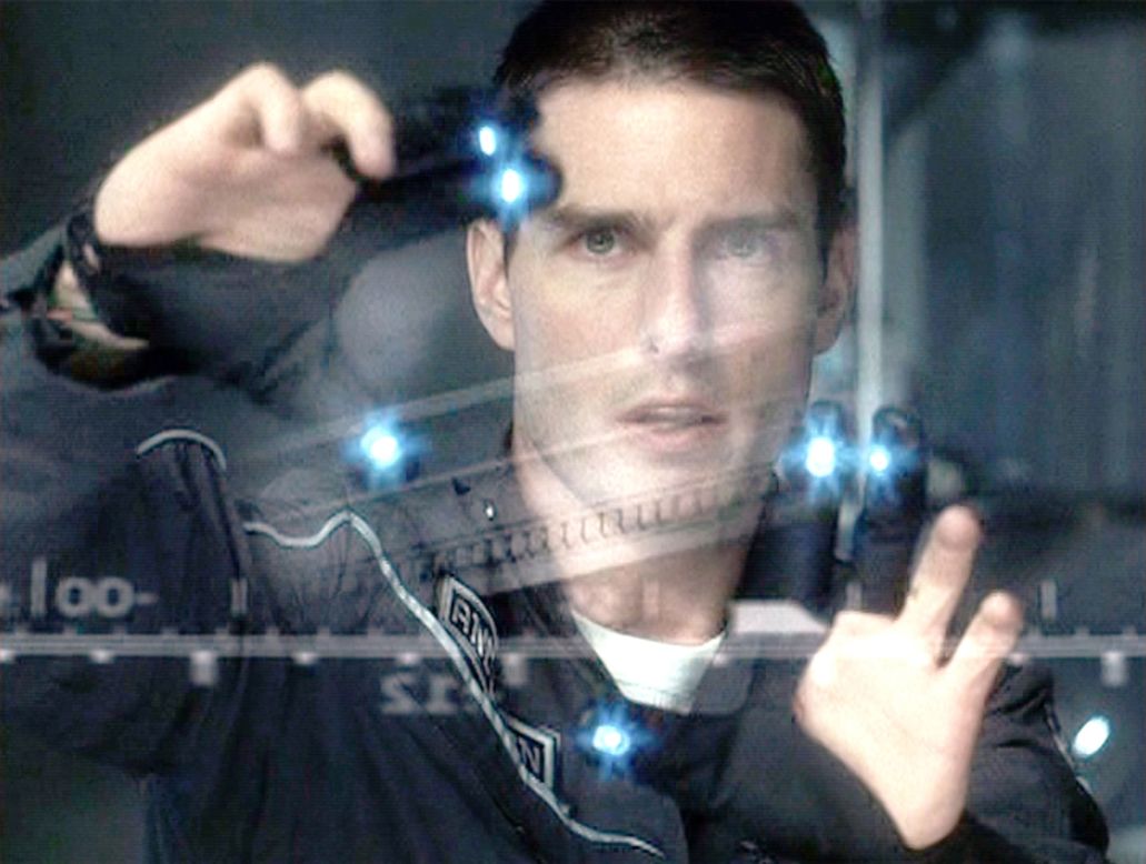 In the 2002 movie, "Minority Report" -- based on the 1956 short story by Philip K. Dick -- John Anderton (played by Tom Cruise) uses a gesture-based computer system, swiping and zooming through multiple screens. 