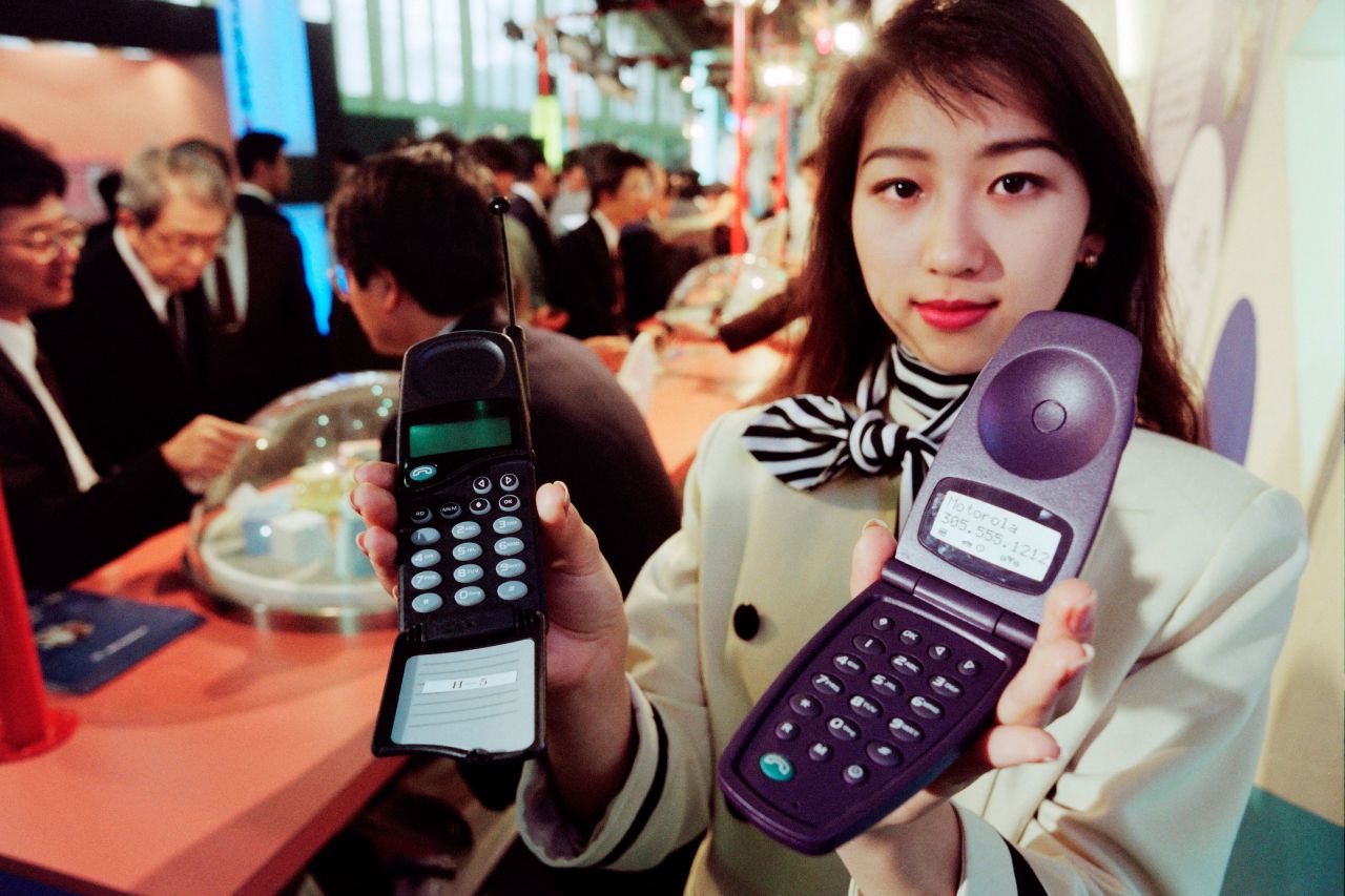 Mobile flip phones were pioneered by Motorola. These early prototypes were displayed at the Communications Tokyo exhibition in 1995. 