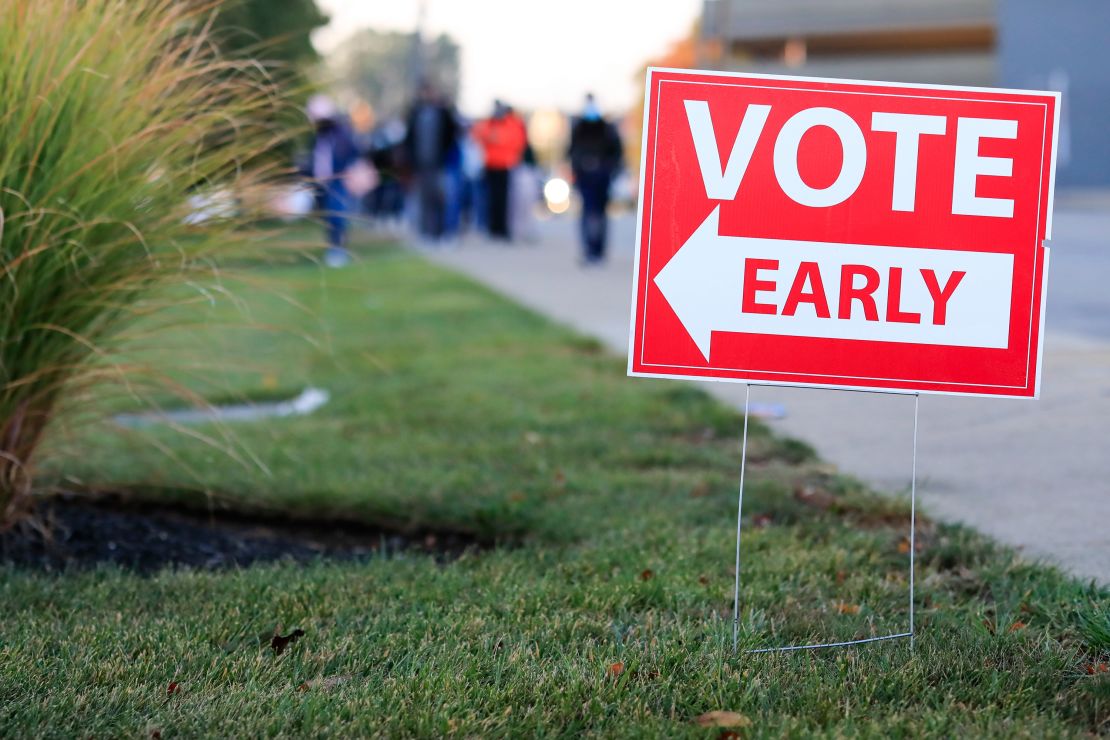 People wait in line to participate in early voting on October 6, 2020, in Norwood, Ohio. 