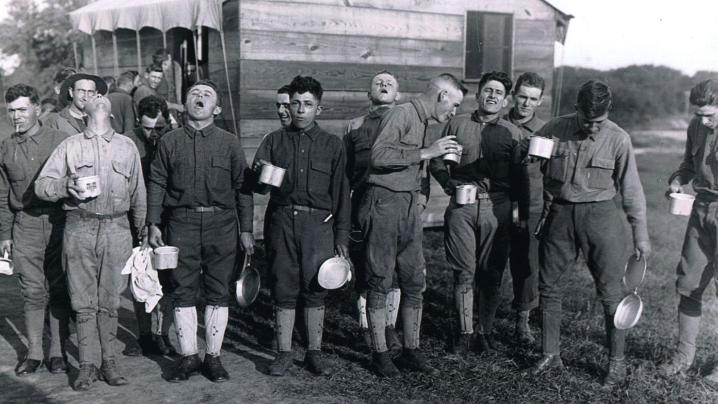 In September 1918 during the influenza pandemic, these men gargled salt water after a day working at Camp Dix in New Jersey. This was a preventative measure against the 1918 flu, which had spread to army camps. 