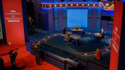 Workers and Debate commission personnel prepare the stage at Kingsbury Hall, the site of the first Vice Presidential debate of the US 2020 election, at the University of Utah on October 6, 2020 in Salt Lake City, Utah. 