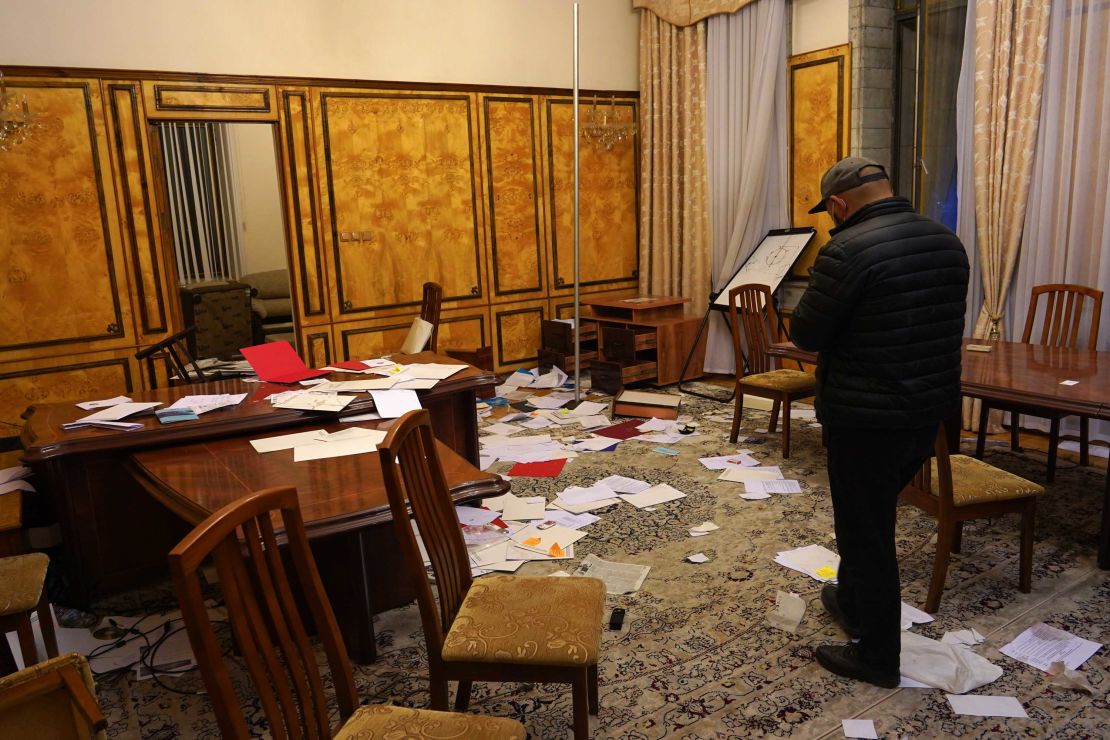 Documents are scattered across a room in the White House after it was ransacked by protesters.