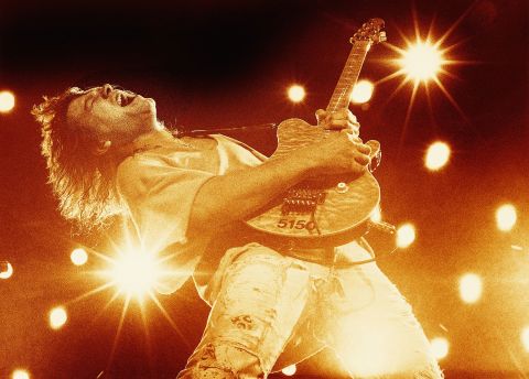 Eddie Van Halen plays guitar in 1993. 