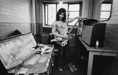 Van Halen tunes up backstage before a performance at Lewisham Odeon in England in May 1978, during the band's first world tour.