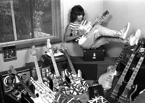 Van Halen poses with his guitar collection at his home in Los Angeles in 1982.