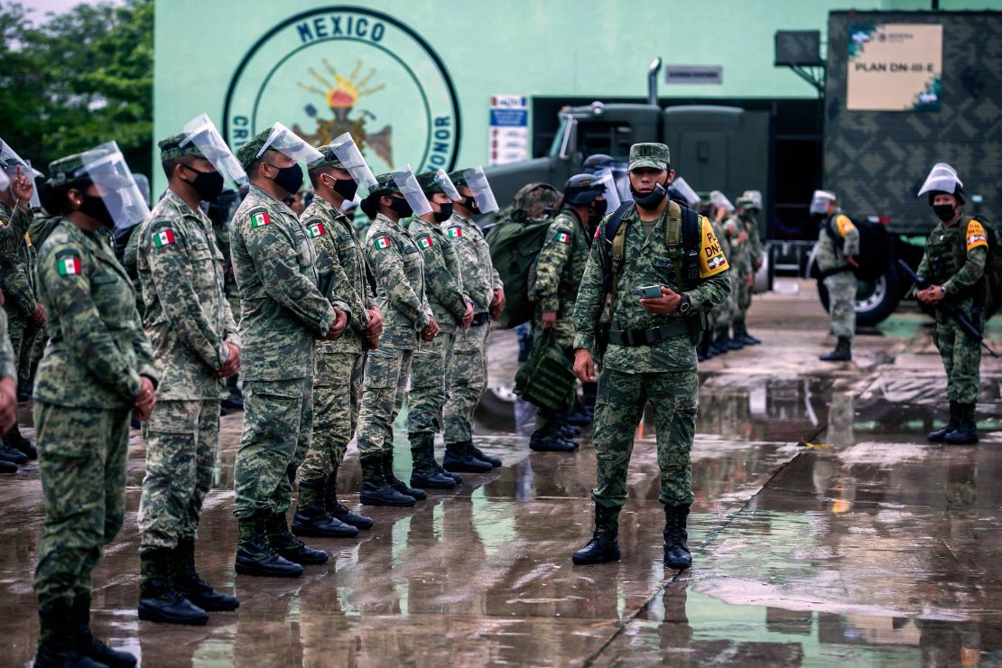 Members of the Mexican Army prepare to move toward Valladolid and Tizimin, in Yucatan state, before the arrival of Hurricane Delta.