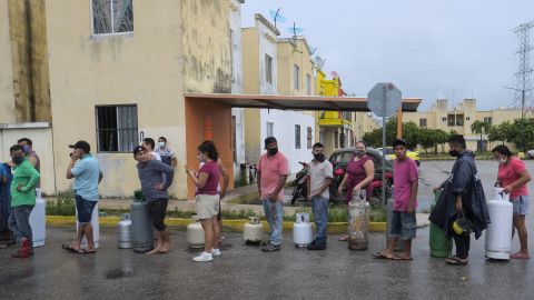 Residents in Cancun line up to buy gas prior to the arrival of Hurricane Delta.