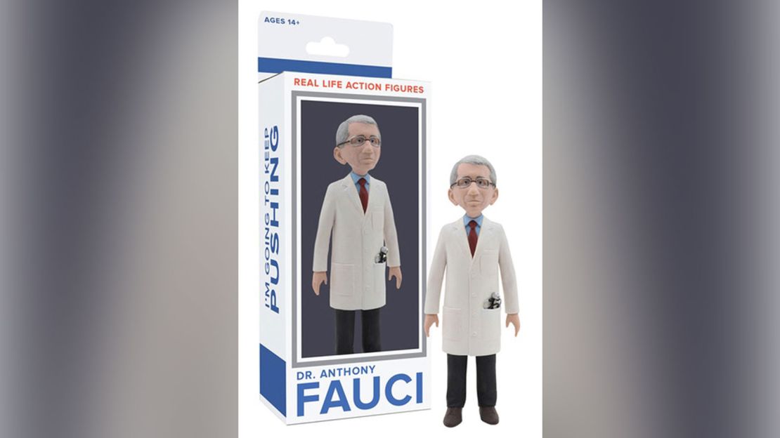 Dr. Fauci's figurine is dressed in a white coat and removable mask.