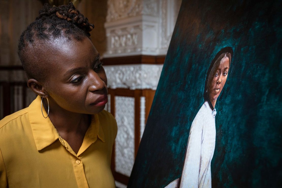 The painting of Bonetta by artist Hannah Uzor (pictured with painting) is on display at Osborne throughout October during Black History Month.