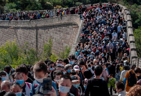 Tourists crowd together in Beijing as they move slowly on a section of the Great Wall of China on October 4. The scene would have been unthinkable just months ago.