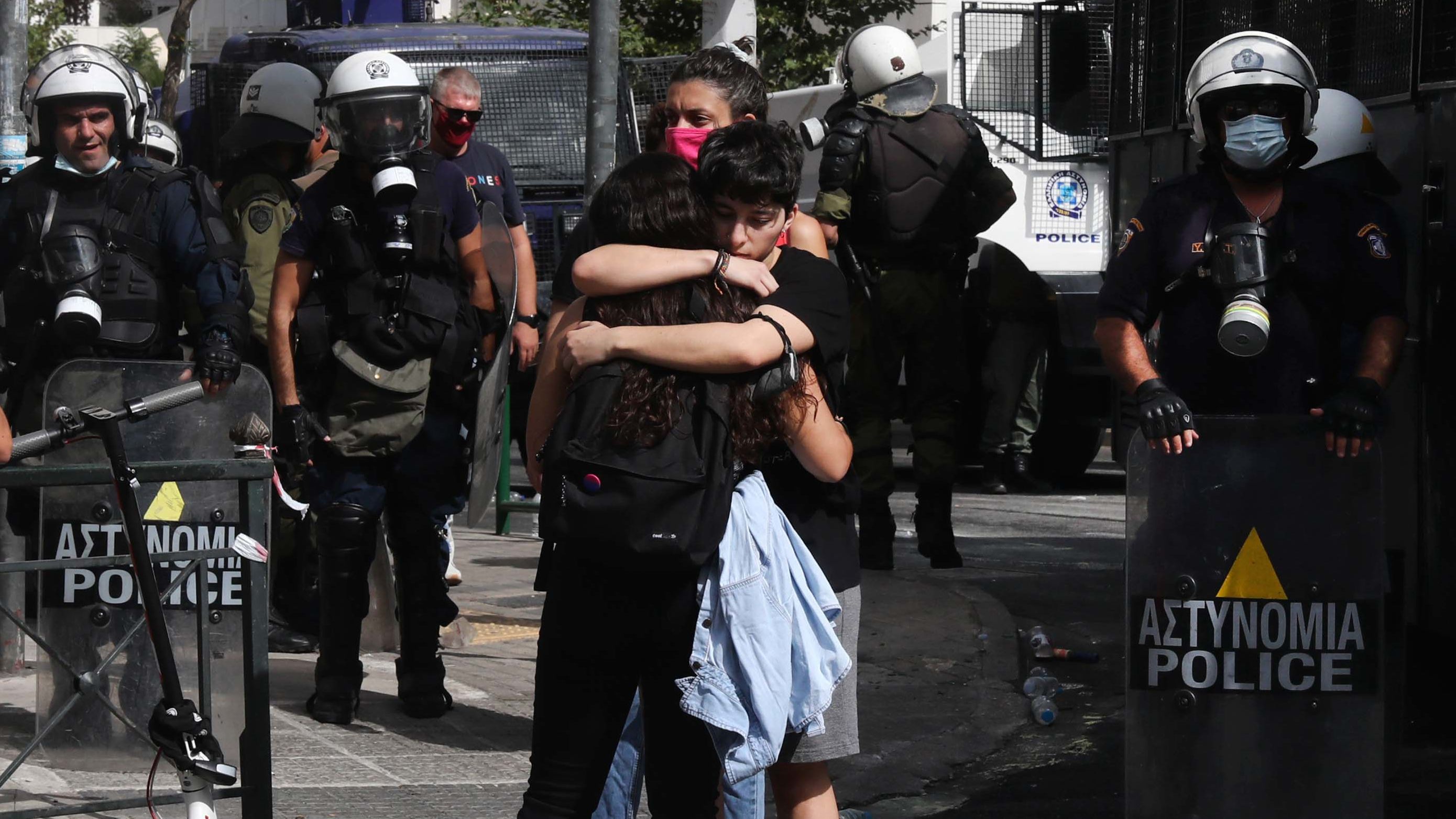 Protesters at the anti-fascist rally, embrace each other following the announcement of the verdict, outside the courthouse in Athens on Wednesday.