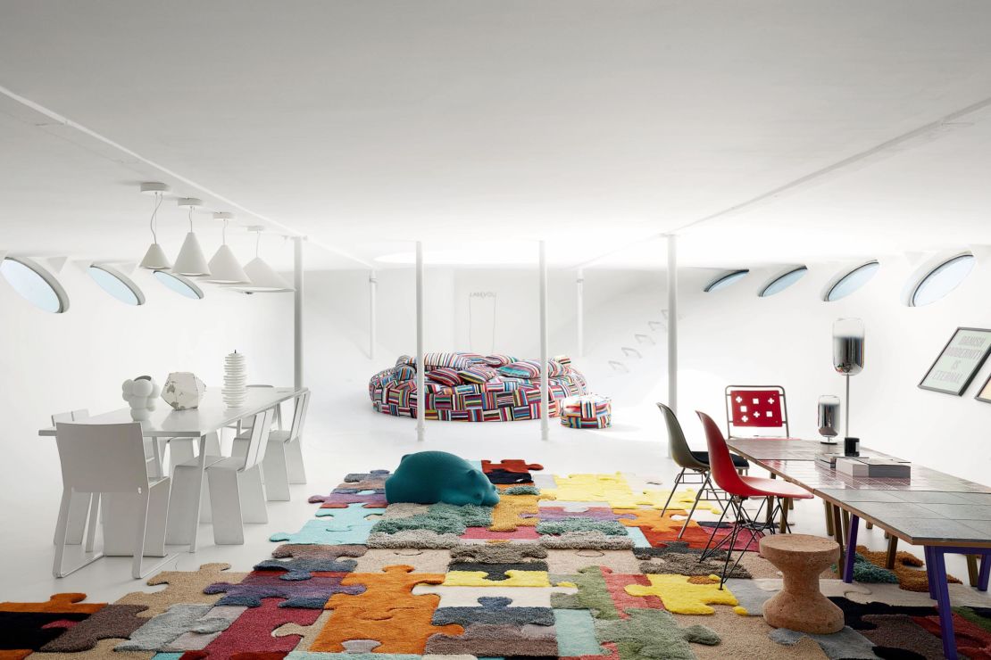 The family playroom features patchwork beanbags and pillows