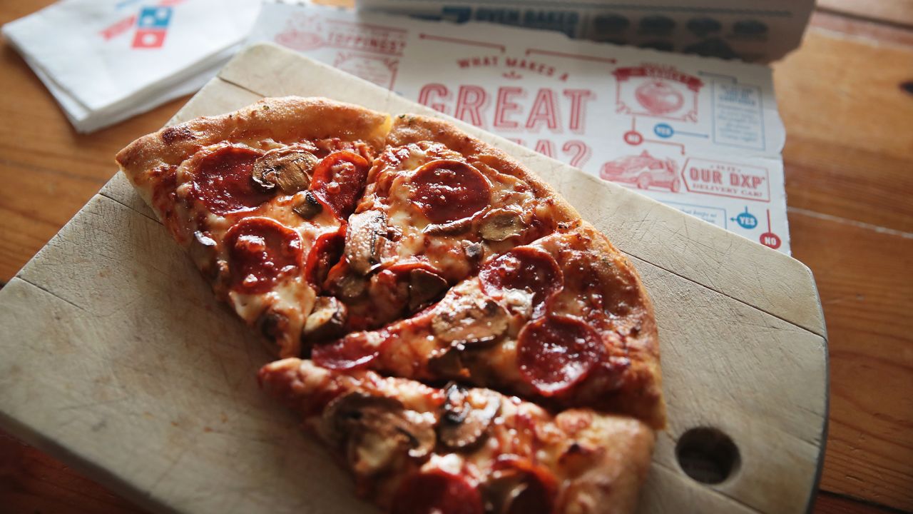 Domino's said its pizza delivery times are increasing a bit in some areas because of staffing shortages.