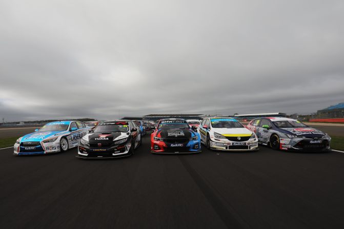 Racing cars lining up at Silverstone. The British Touring Car Championship was <a href="index.php?page=&url=https%3A%2F%2Fwww.btcc.net%2Fabout%2F" target="_blank" target="_blank">established</a> in 1958. 