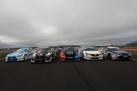 Racing cars lining up at Silverstone. The British Touring Car Championship was <a href="https://www.btcc.net/about/" target="_blank" target="_blank">established</a> in 1958. 