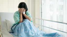 woman crying hospital STOCK
