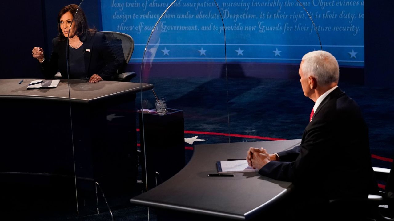 US Vice President Mike Pence listens as US Democratic vice presidential nominee and Senator from California, Kamala Harris during he vice presidential debate in Kingsbury Hall at the University of Utah on October 7, 2020, in Salt Lake City, Utah.