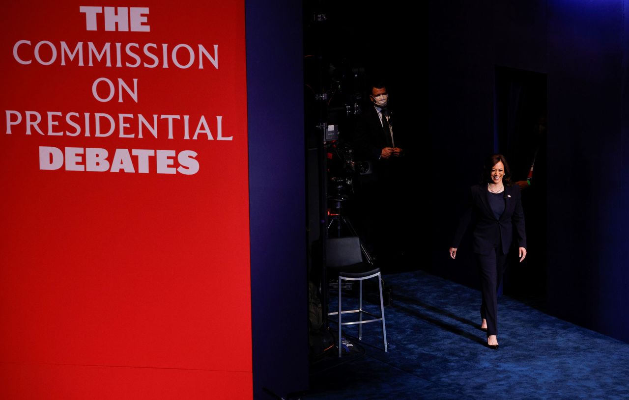 Harris walks onto the stage for the start of the debate.
