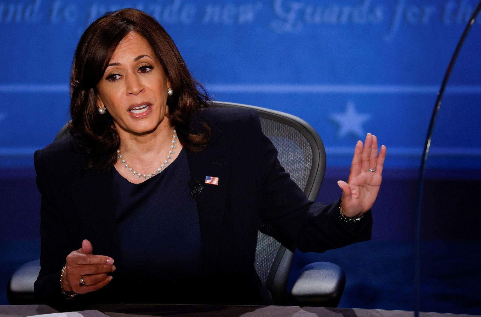 Harris gestures at Pence while answering a question during the debate. She made history Wednesday, becoming the first Black and South Asian woman to participate in a general election debate.