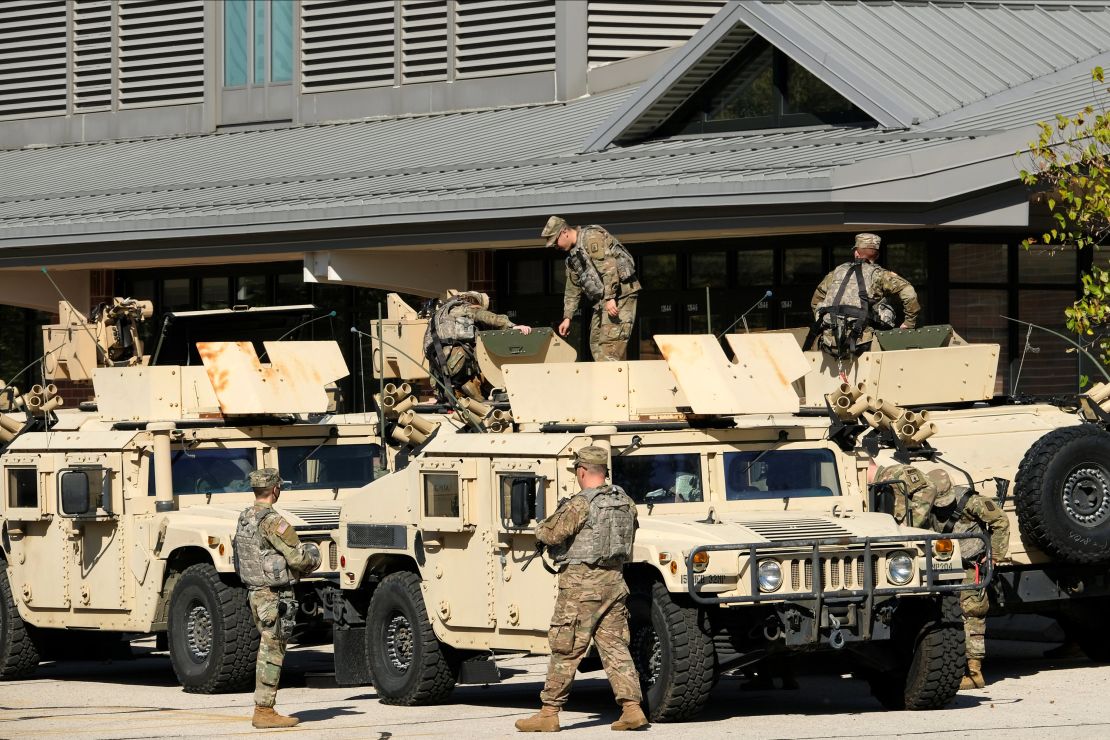 National Guard members are seen outside the Wisconsin State Fair exposition center in West Allis on Wednesday, where a field hospital to treat Covid-19 patients has been set up.