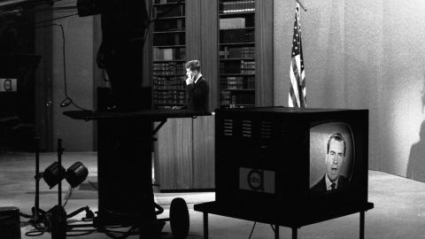 In a studio at ABC television, Senator John F. Kennedy holds his hand to his ear as he listens to his opponent, Vice President Richard M. Nixon, during a televised Presidential debate on October 13, 1960. (Photo by Paul Schutzer/The LIFE Picture Collection via Getty Images)
