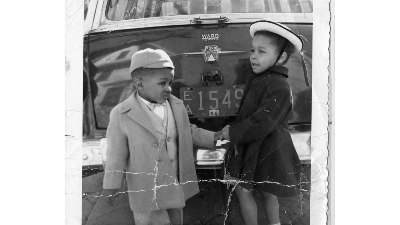 Sorin's father was an avid photographer and took this photo of his children in front of their car. 