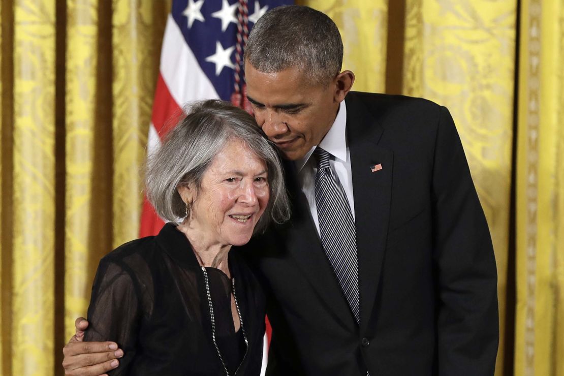 Former President Barack Obama embraces the poet before awarding her the 2015 National Humanities Medal during a ceremony at the White House.