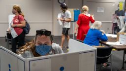 FAIRFAX, VIRGINIA - SEPTEMBER 18: Voters cast ballots, spaced  apart due to covid-19 at the Fairfax Government Center on September 18, 2020 in Fairfax, Virginia. Voters waited up to four hours to early vote in the upcoming 2020 presidential election, polls opened at 8am, and people where in line at 5:45am according to poll workers. (Photo by Tasos Katopodis/Getty Images)