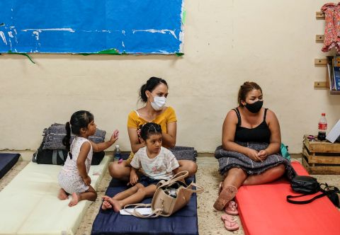 People rest in a shelter prior to the arrival of Hurricane Delta in Cancun on Tuesday, October 6.