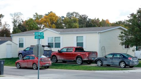 Vehicles are seen outside of a Hartland Township mobile home park the FBI searched late Wednesday night and into the morning in connection of a plot to kidnap Michigan Gov. Gretchen Whitmer.